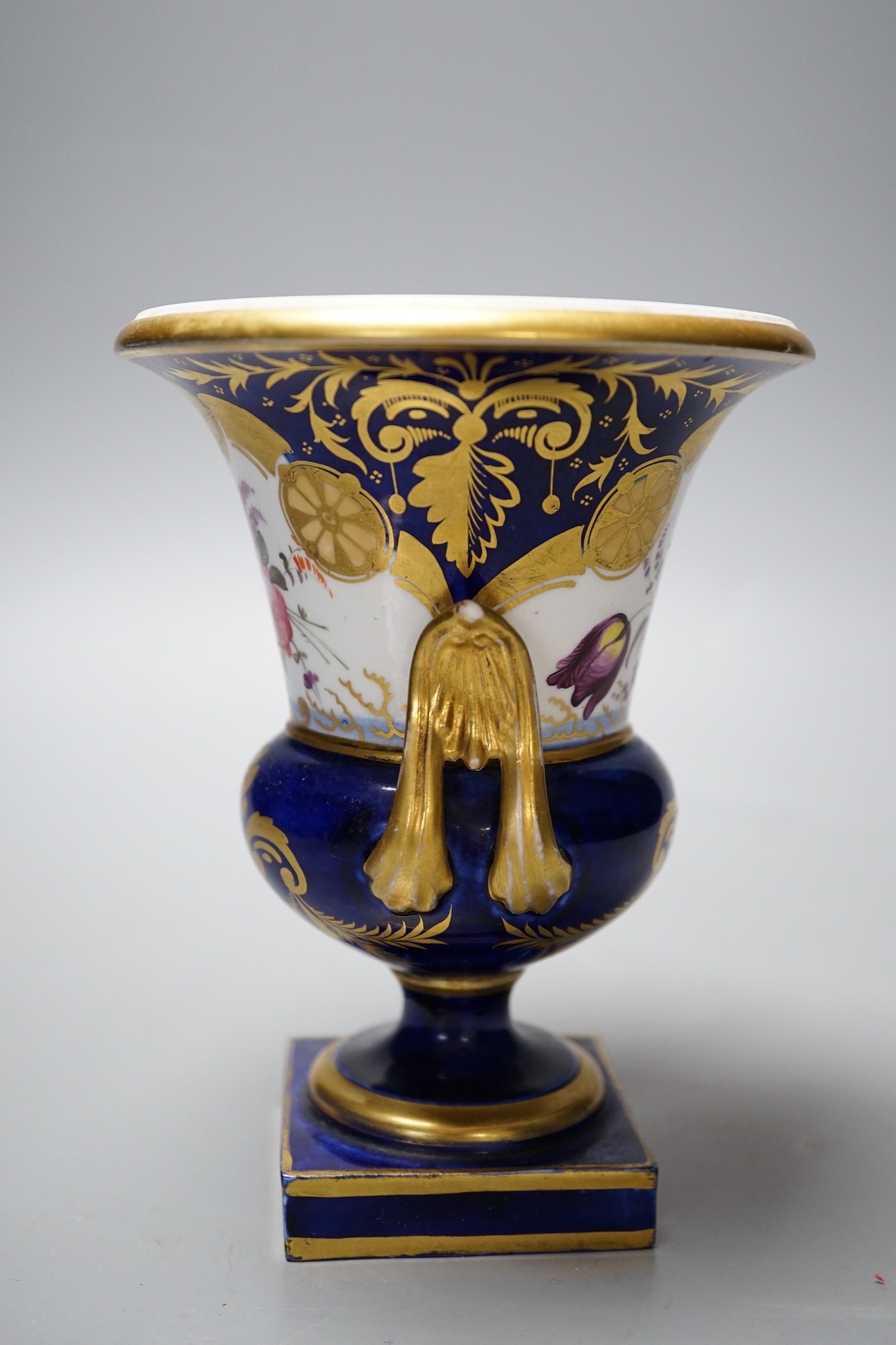 A Paris porcelain two-handled vase urn, with floral decoration, 16cm tall